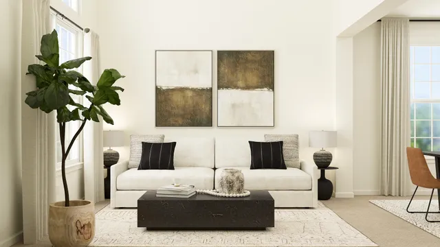 a living room with furniture and a potted plant