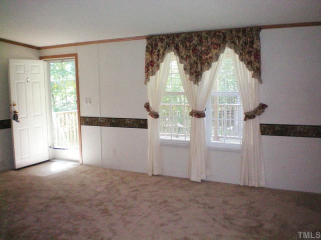 7422 Jock Road Bahama, NC 27503 - Photo 3 of 12 an empty room with windows