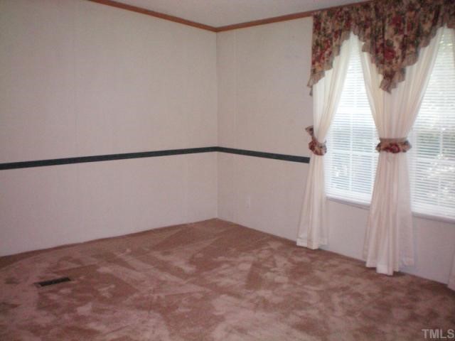 7422 Jock Road Bahama, NC 27503 - Photo 8 of 12 a view of an empty room with a window