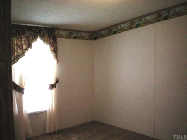 7422 Jock Road Bahama, NC 27503 - Photo 10 of 12 a view of walk in closet with a window