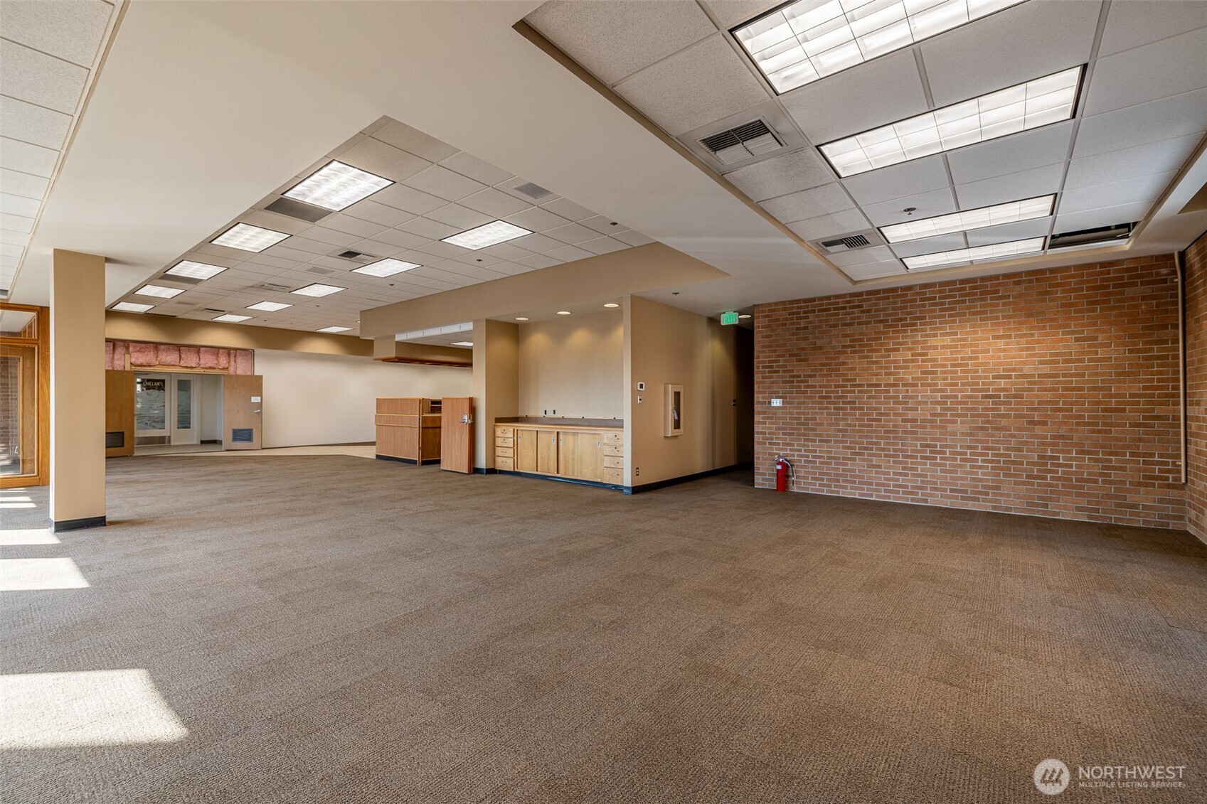 30 South Mission Street, Unit B Wenatchee, WA 98801 - Photo 7 of 16 a view of a livingroom with furniture and a window