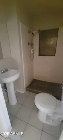 a bathroom with a toilet and a sink