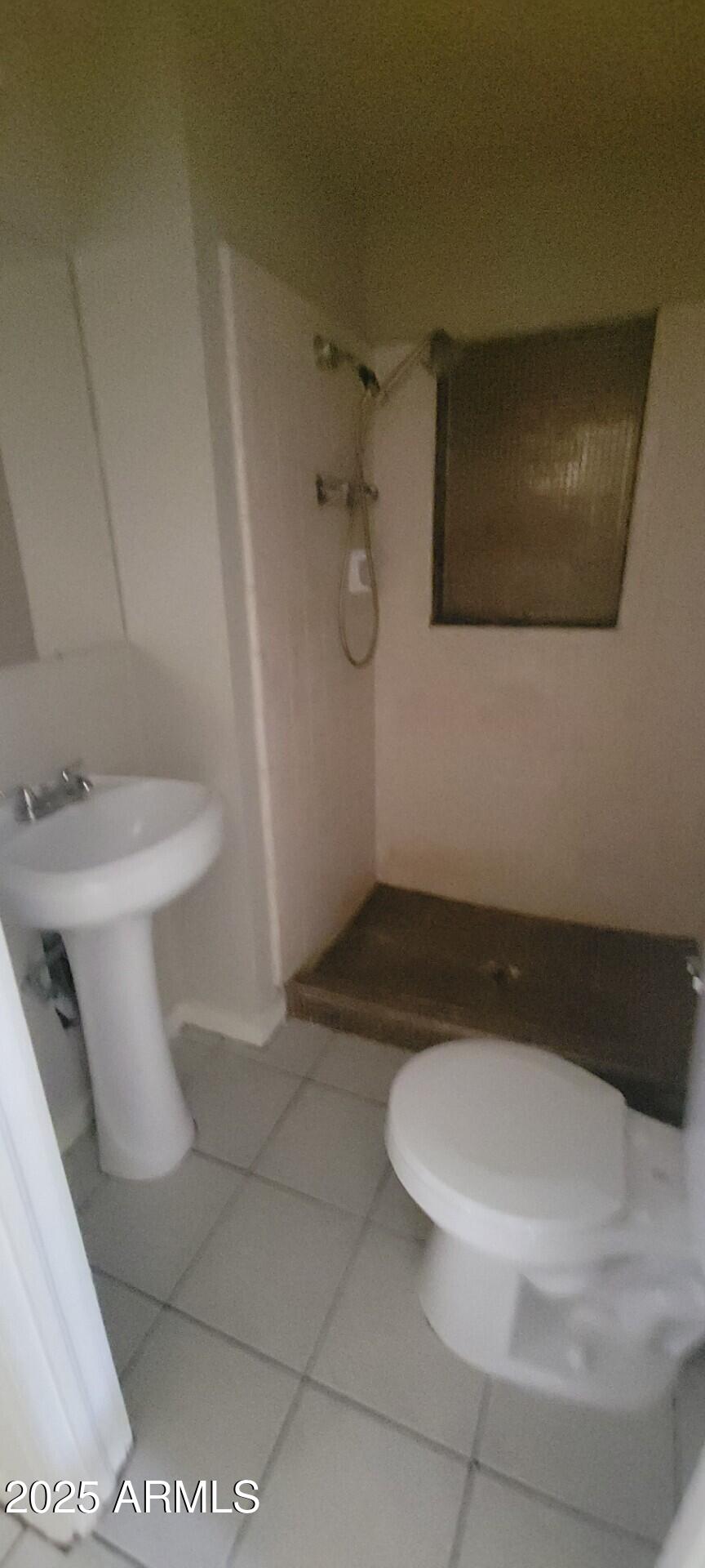 a bathroom with a toilet and a sink