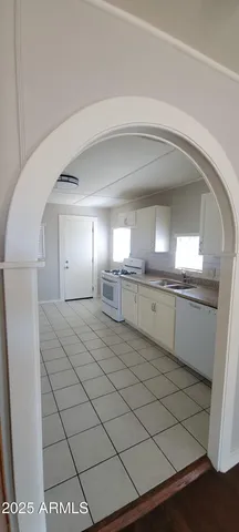 a bathroom with a sink a mirror and a vanity