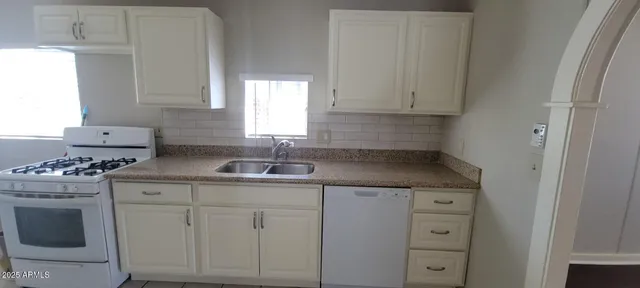 a backyard of a house with a yard