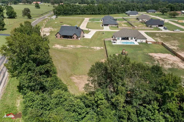 a view of a swimming pool and a yard