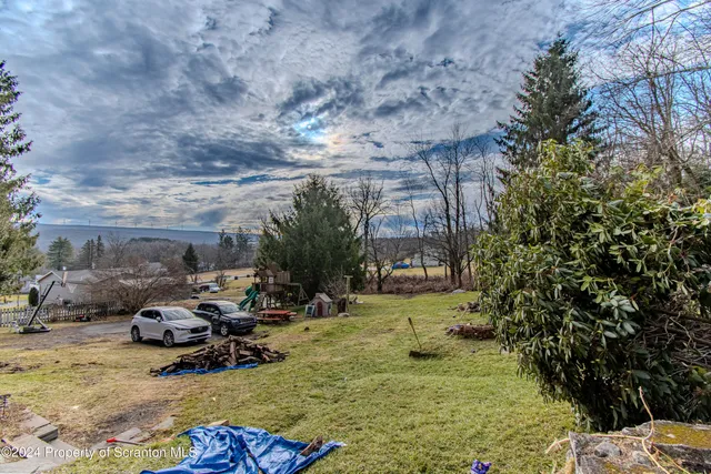 a view of yard with cars parked