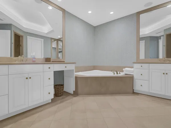 a bathroom with a bathtub and a sink