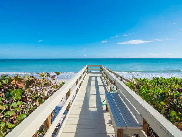 a view of a balcony with an ocean view