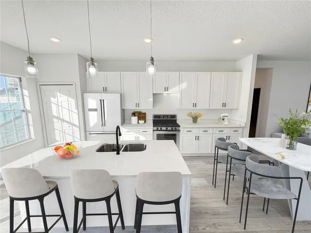 a bedroom with a bed and a mirror on dresser