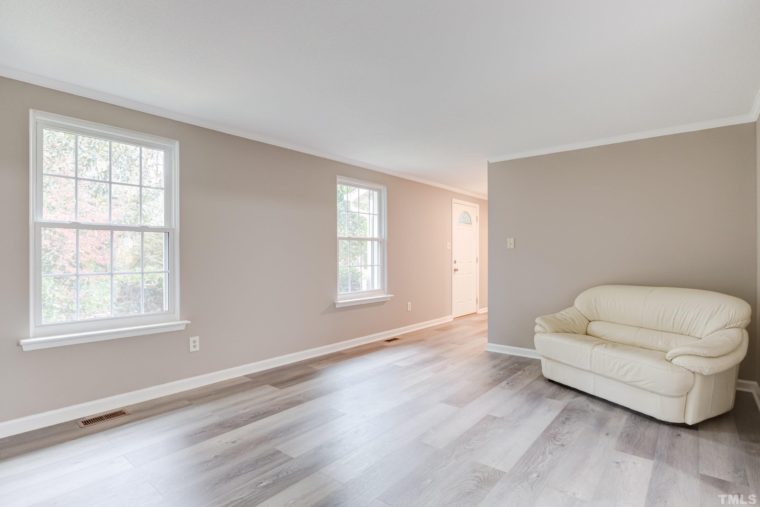1012 Ironstone Court Raleigh, NC 27615 - Photo 3 of 41 a living room with furniture and a window