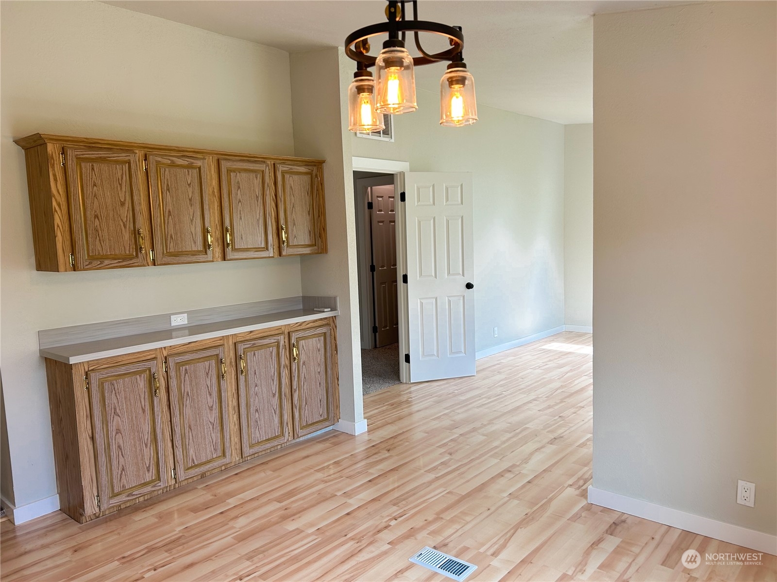 112 Levig Road Port Angeles, WA 98362 - Photo 20 of 37 a view of a kitchen with wooden floor and cabinets