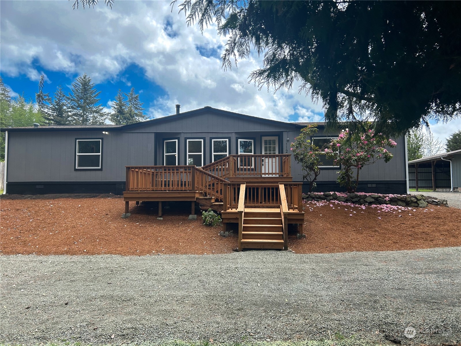 112 Levig Road Port Angeles, WA 98362 - Photo 2 of 37 a house view with a garden space