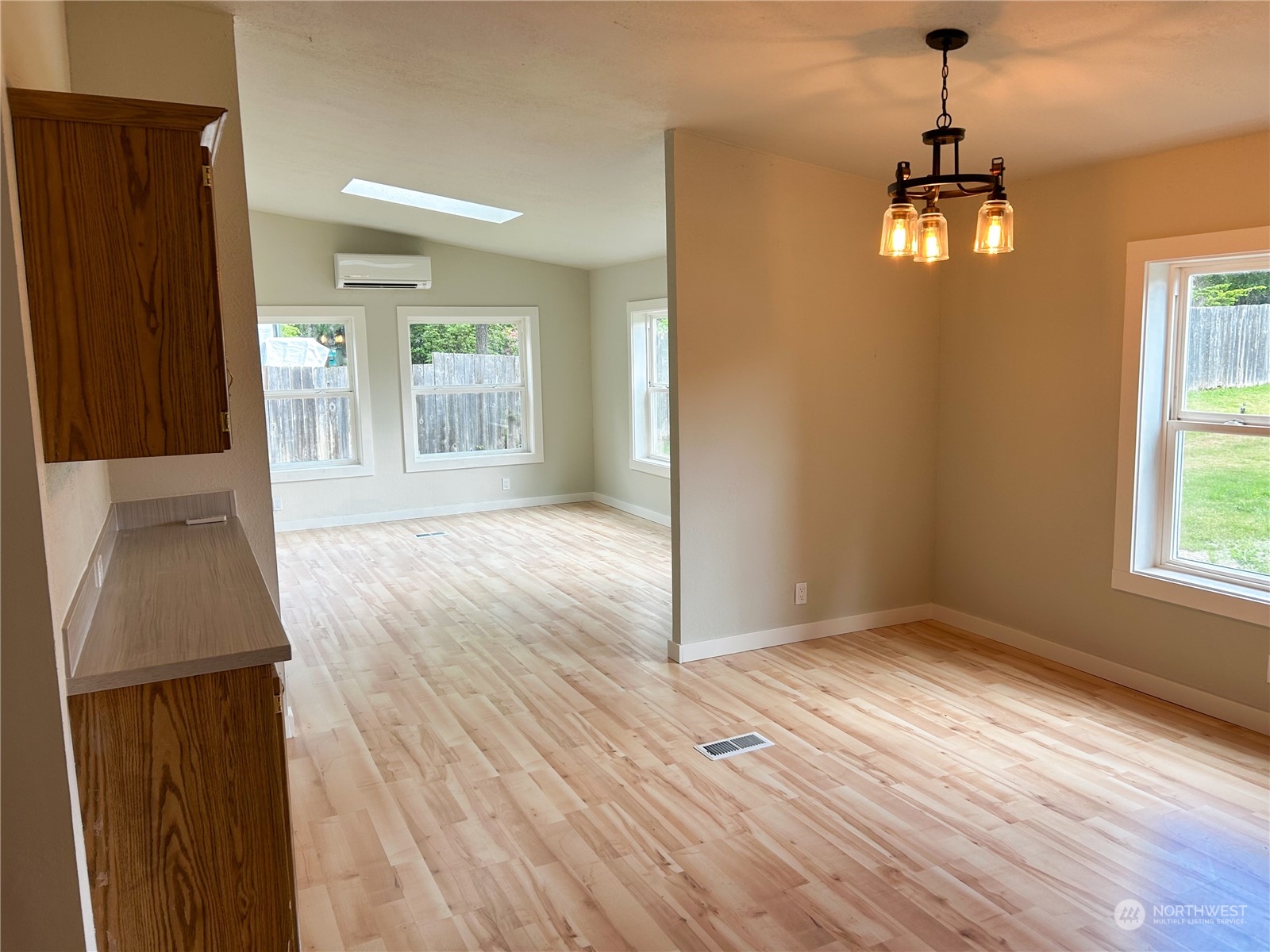 112 Levig Road Port Angeles, WA 98362 - Photo 21 of 37 an empty room with wooden floor and windows