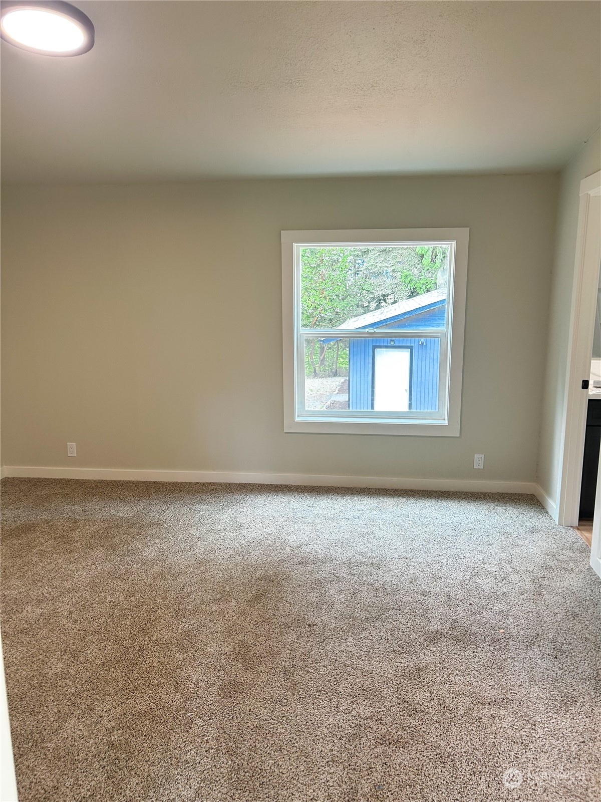 112 Levig Road Port Angeles, WA 98362 - Photo 22 of 37 an empty room with a window