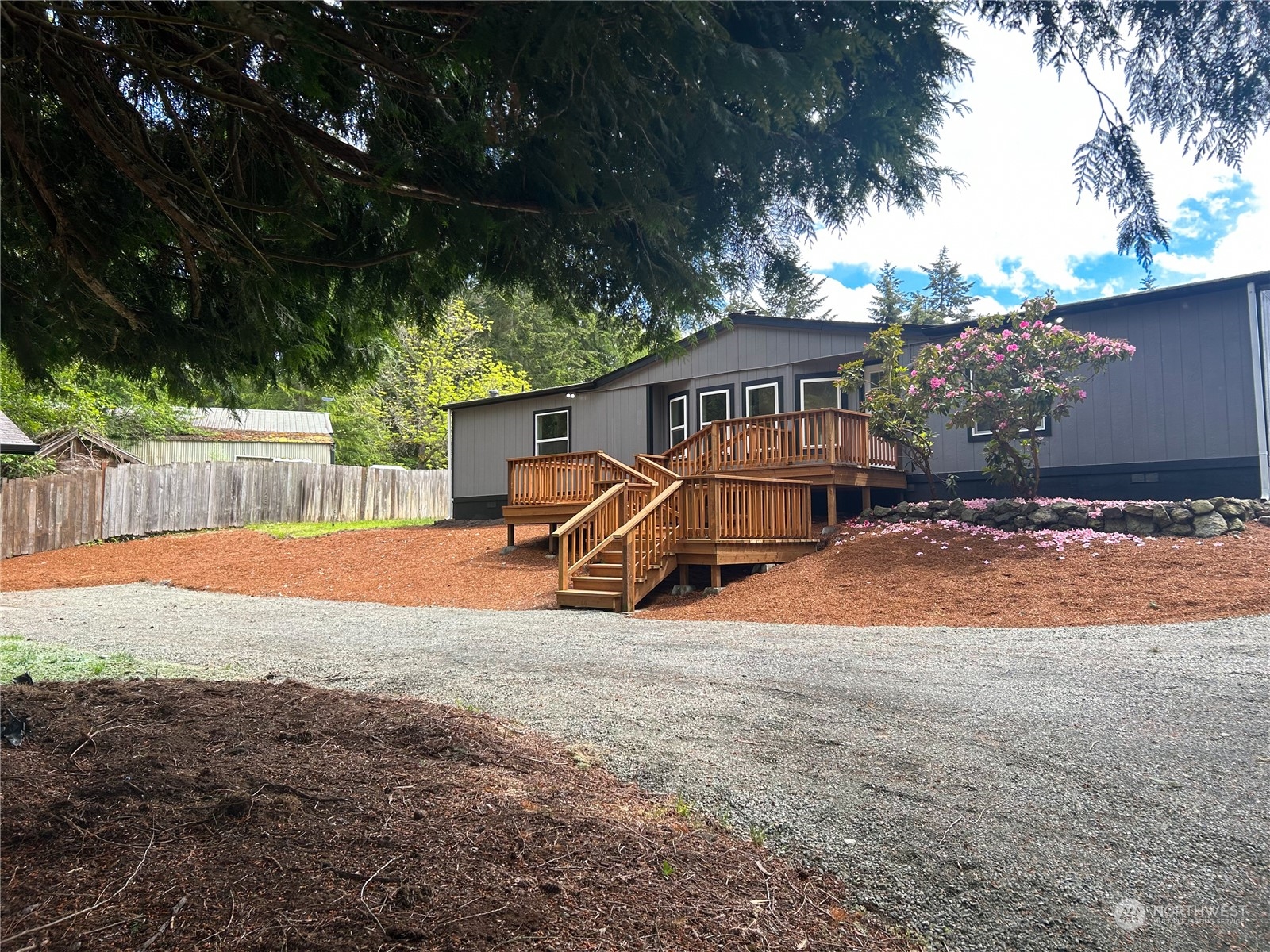 112 Levig Road Port Angeles, WA 98362 - Photo 3 of 37 a view of a house with backyard and sitting area