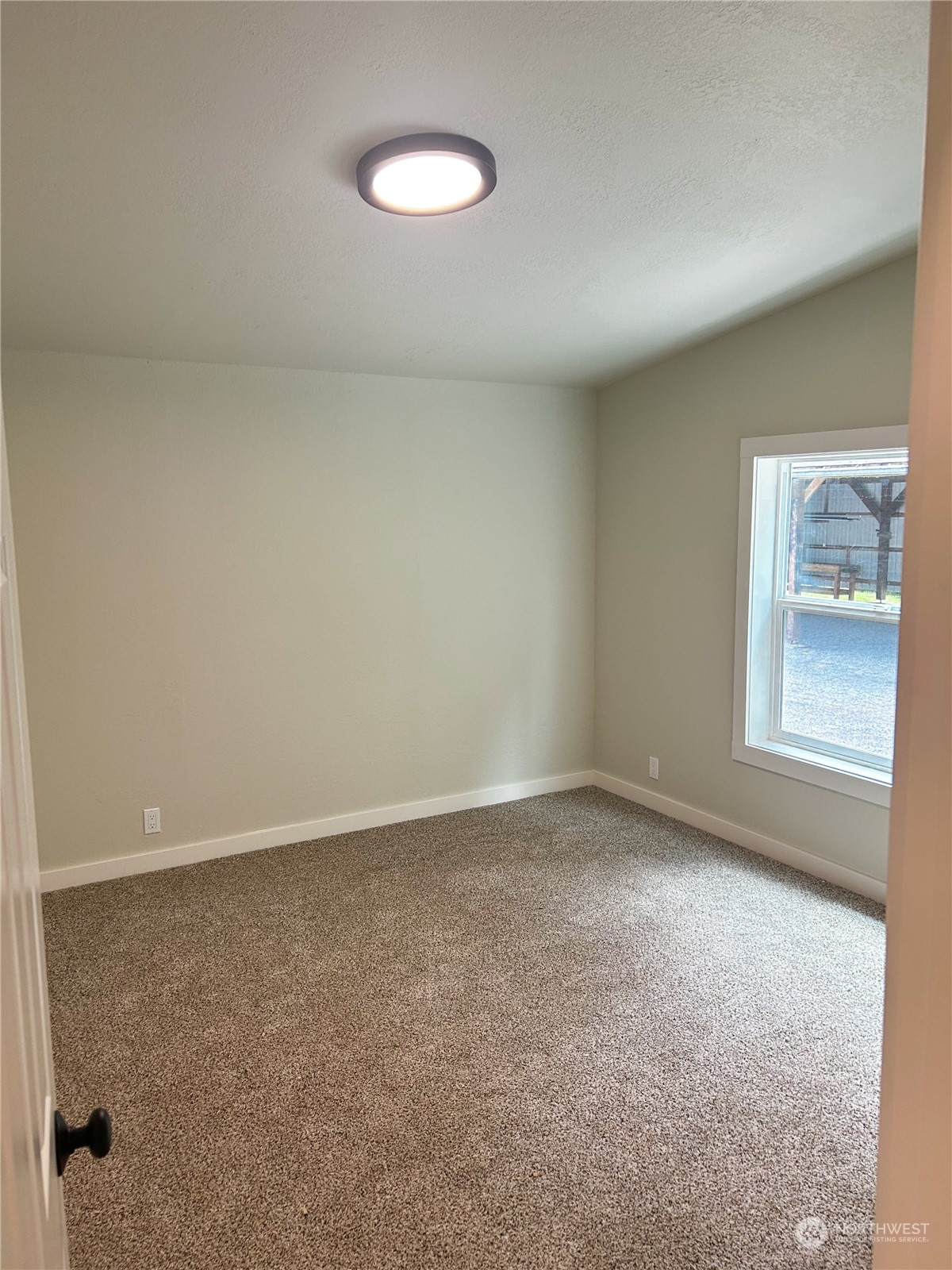 112 Levig Road Port Angeles, WA 98362 - Photo 10 of 37 an empty room with a window