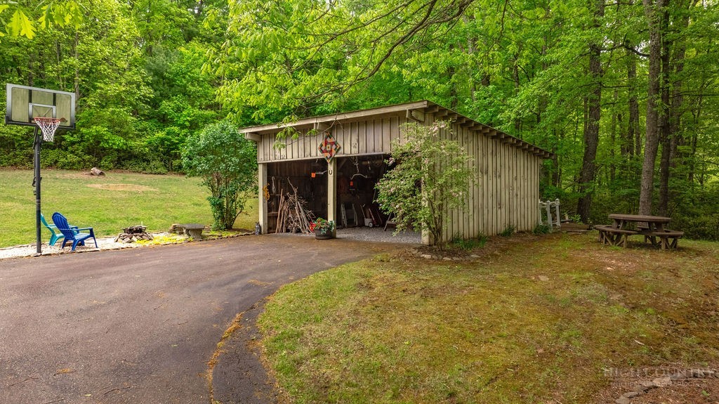970 Vox Road Sparta, NC 28675 - Photo 16 of 50 a view of a house with backyard and garden