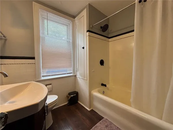 a view of balcony with wooden floor