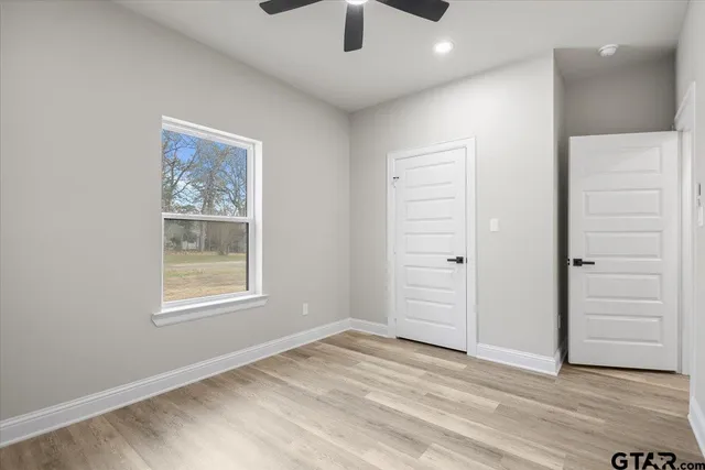 an empty room with a empty space and windows