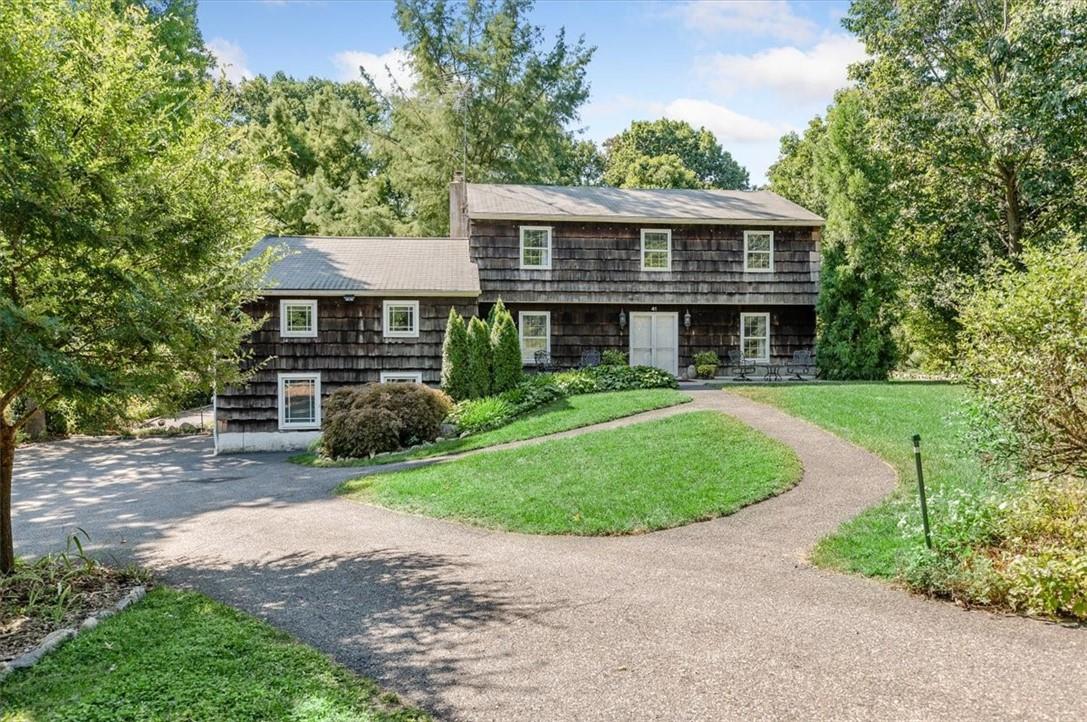 41 Raemont Road Granite Springs, NY 10501 - Photo 1 of 1 a front view of a house with a garden