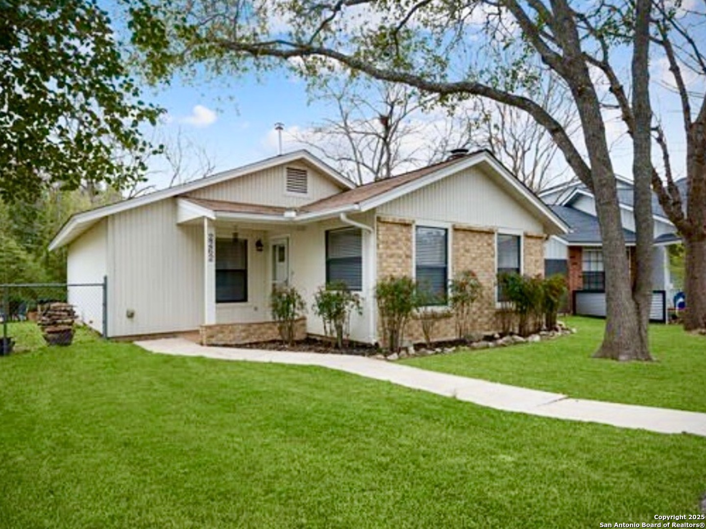 a front view of a house with a yard and porch