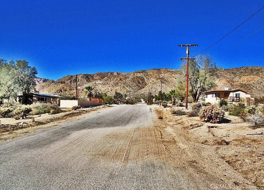 8675 Highland Road Morongo Valley, CA 92256 - Photo 1 of 1 a view of a yard with a house