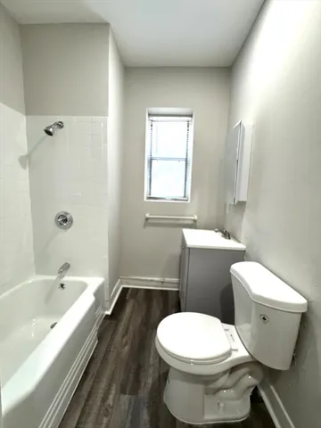 a bathroom with a toilet sink and bathtub