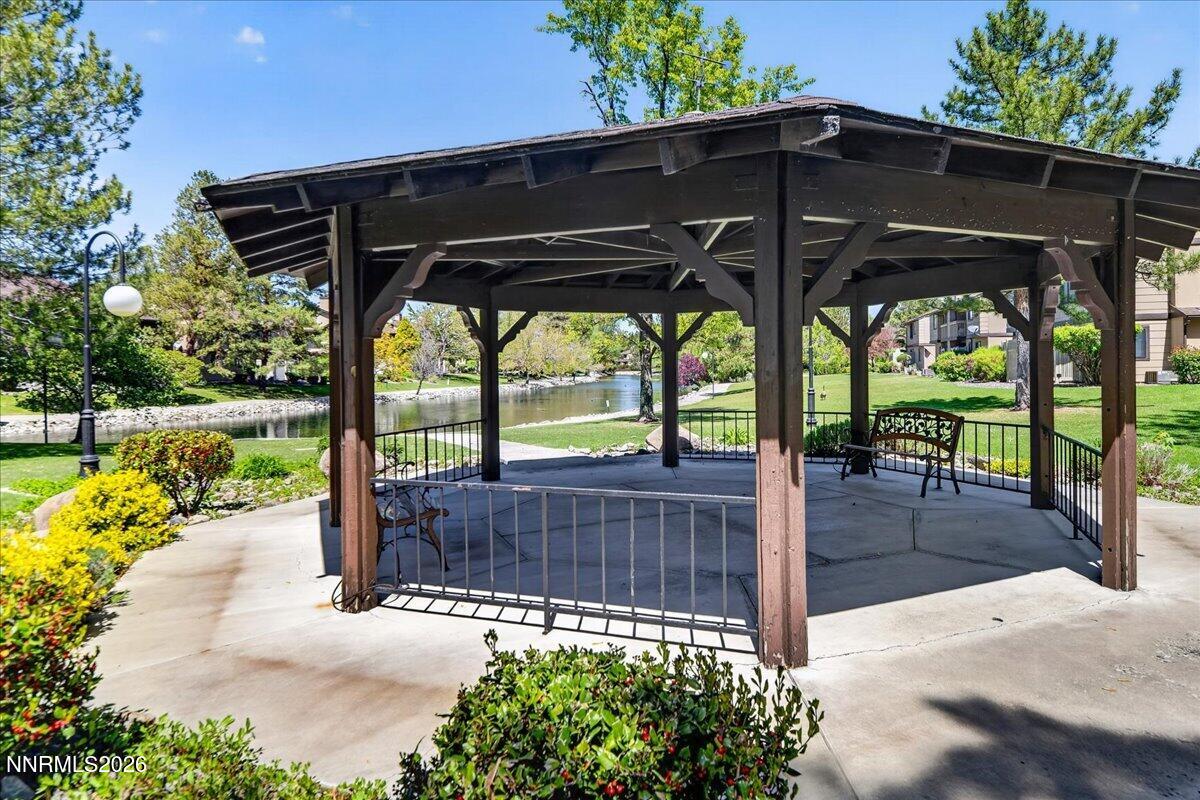 4380 Matich Drive Reno, NV 89502 - Photo 15 of 21 a view of a patio with table and chairs under an umbrella
