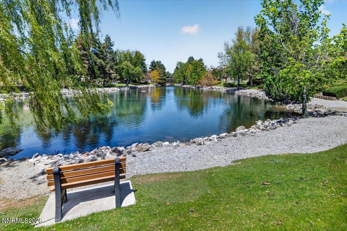 4380 Matich Drive Reno, NV 89502 - Photo 16 of 21 a wooden bench sitting next to a lake
