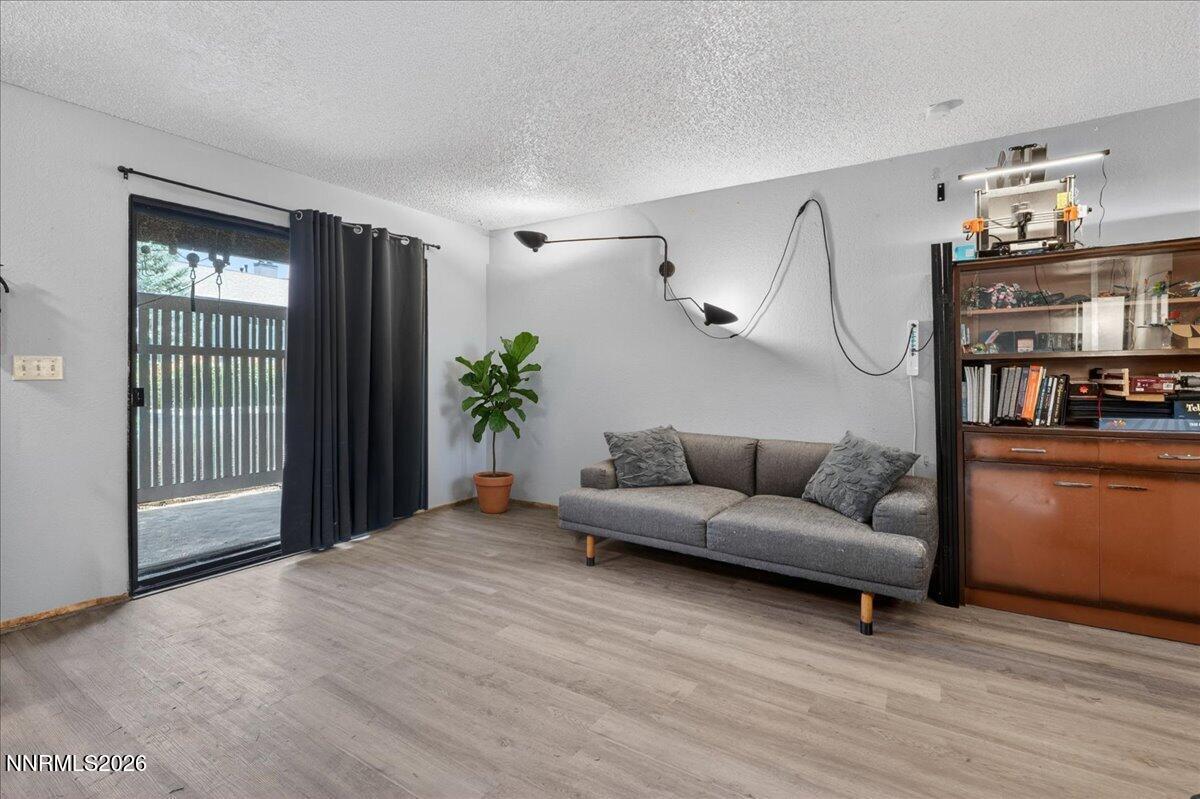 4380 Matich Drive Reno, NV 89502 - Photo 2 of 21 a living room with furniture and a window