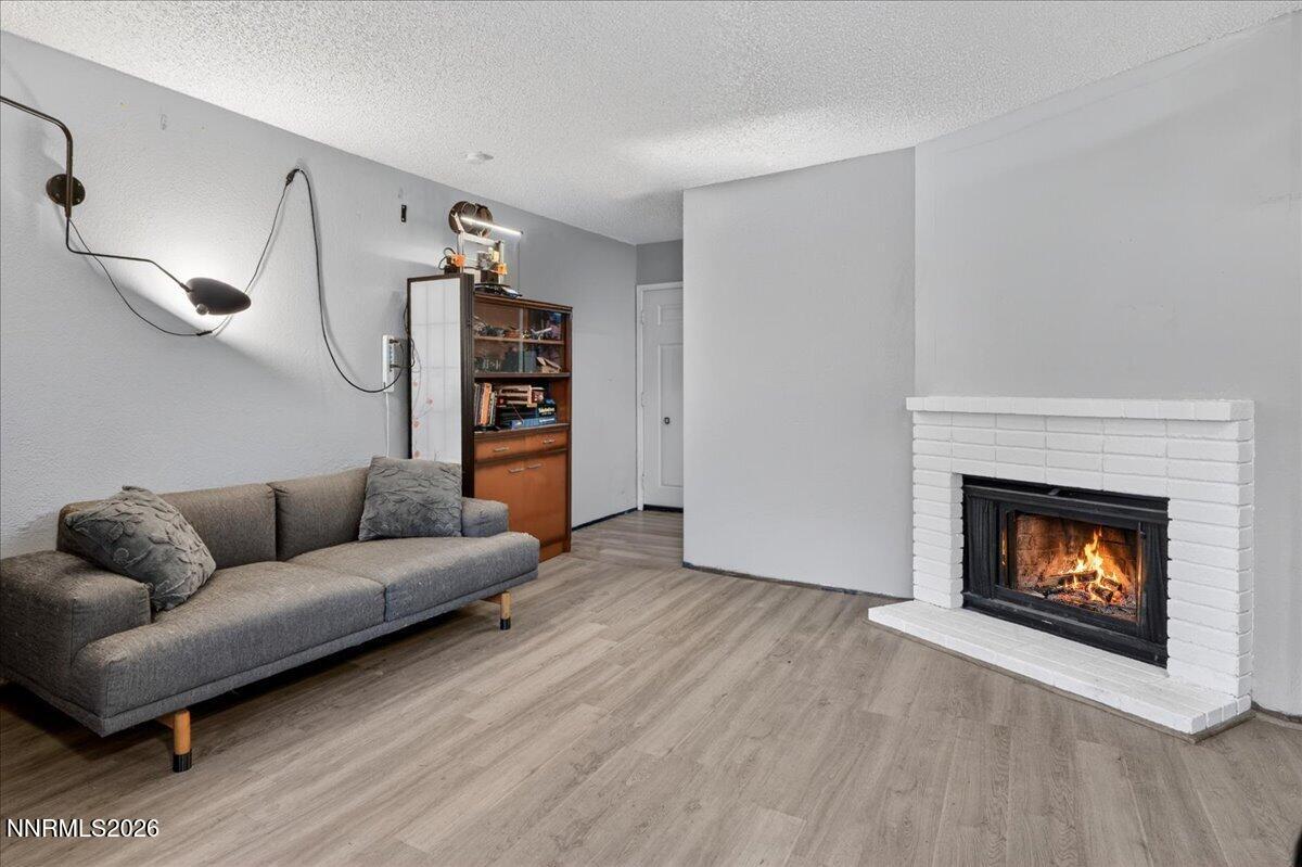 4380 Matich Drive Reno, NV 89502 - Photo 3 of 21 a living room with furniture and a fireplace