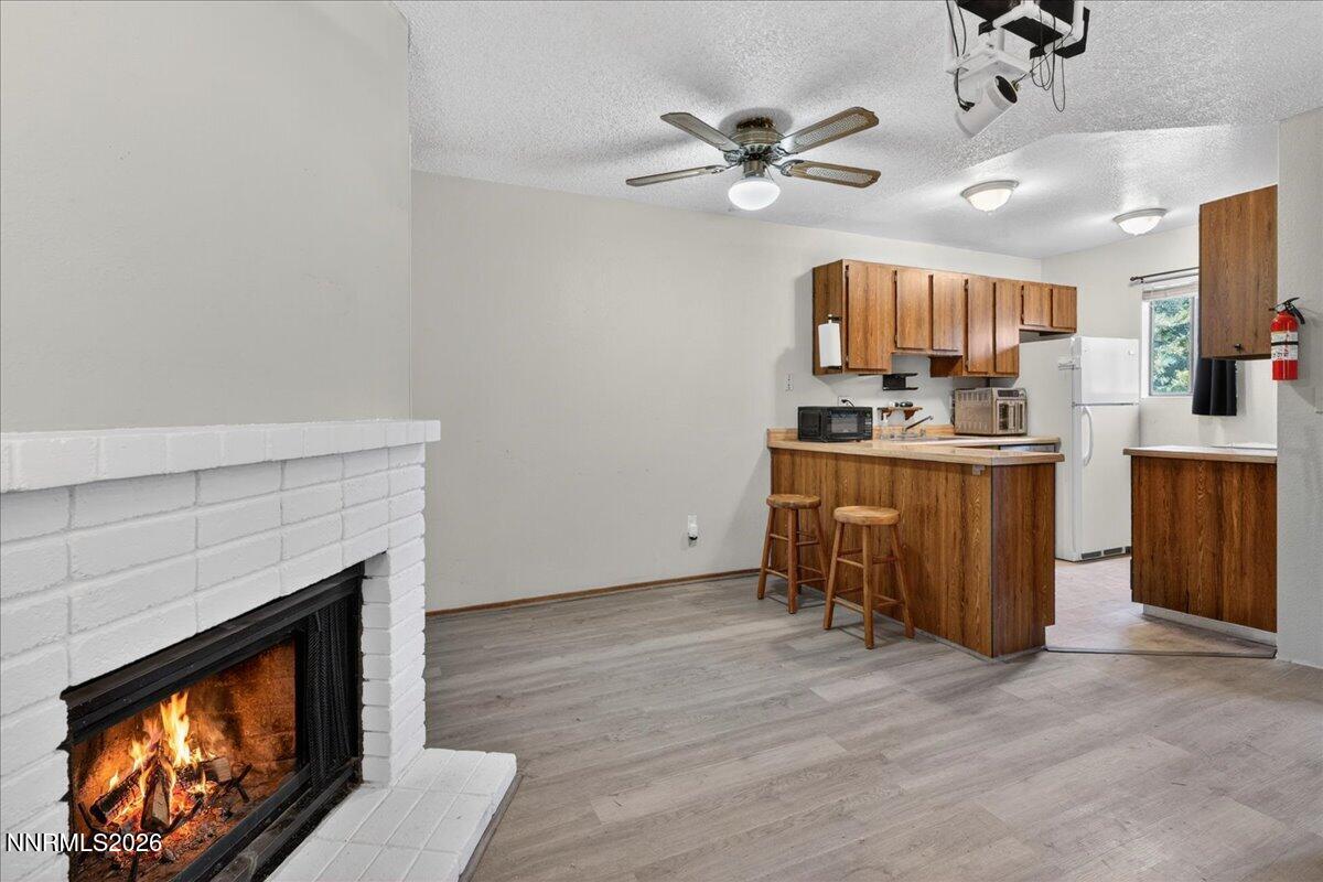 4380 Matich Drive Reno, NV 89502 - Photo 6 of 21 a view of a kitchen with furniture and a fireplace