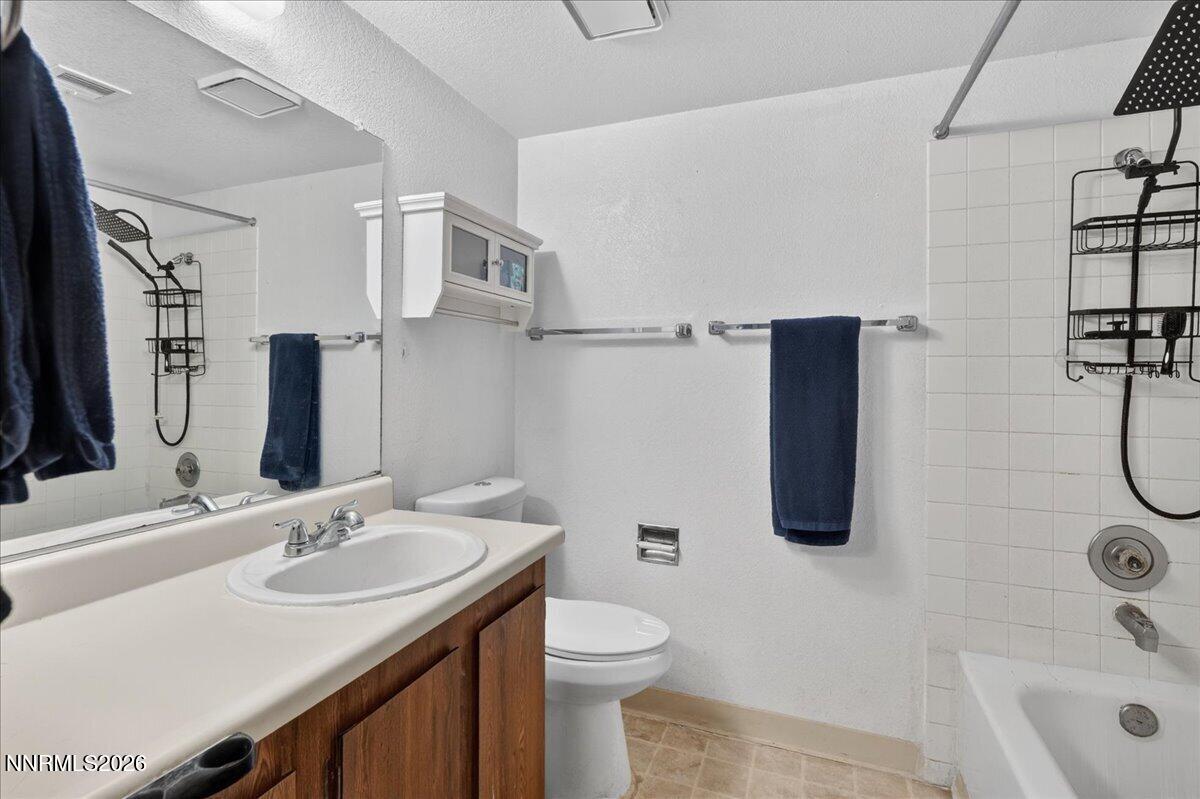 4380 Matich Drive Reno, NV 89502 - Photo 7 of 21 a bathroom with a sink a toilet and shower