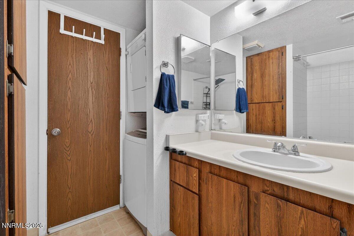 4380 Matich Drive Reno, NV 89502 - Photo 9 of 21 a bathroom with a sink vanity and mirror