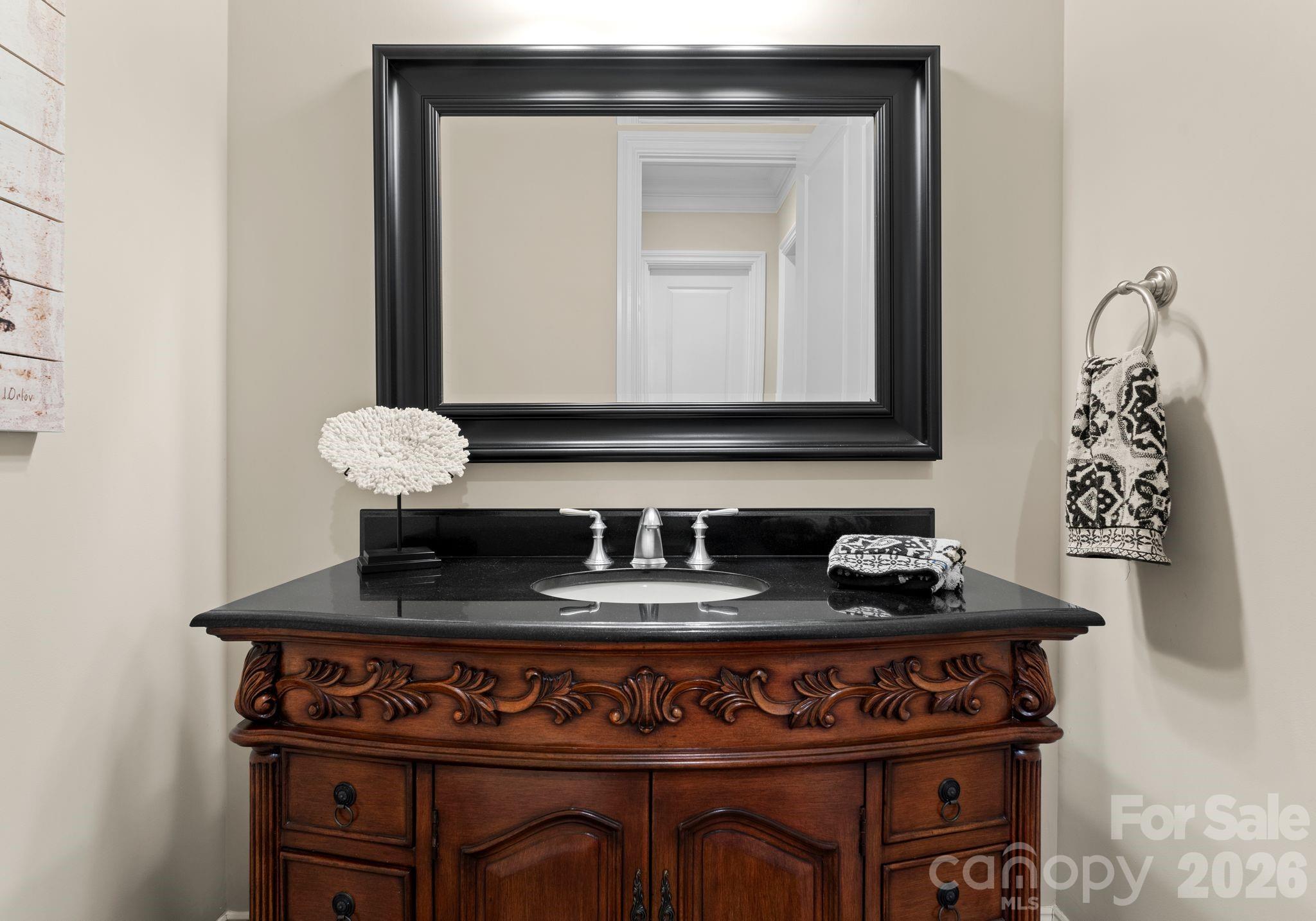 21311 Baltic Drive Cornelius, NC 28031 - Photo 14 of 39 a bathroom with a sink and a mirror