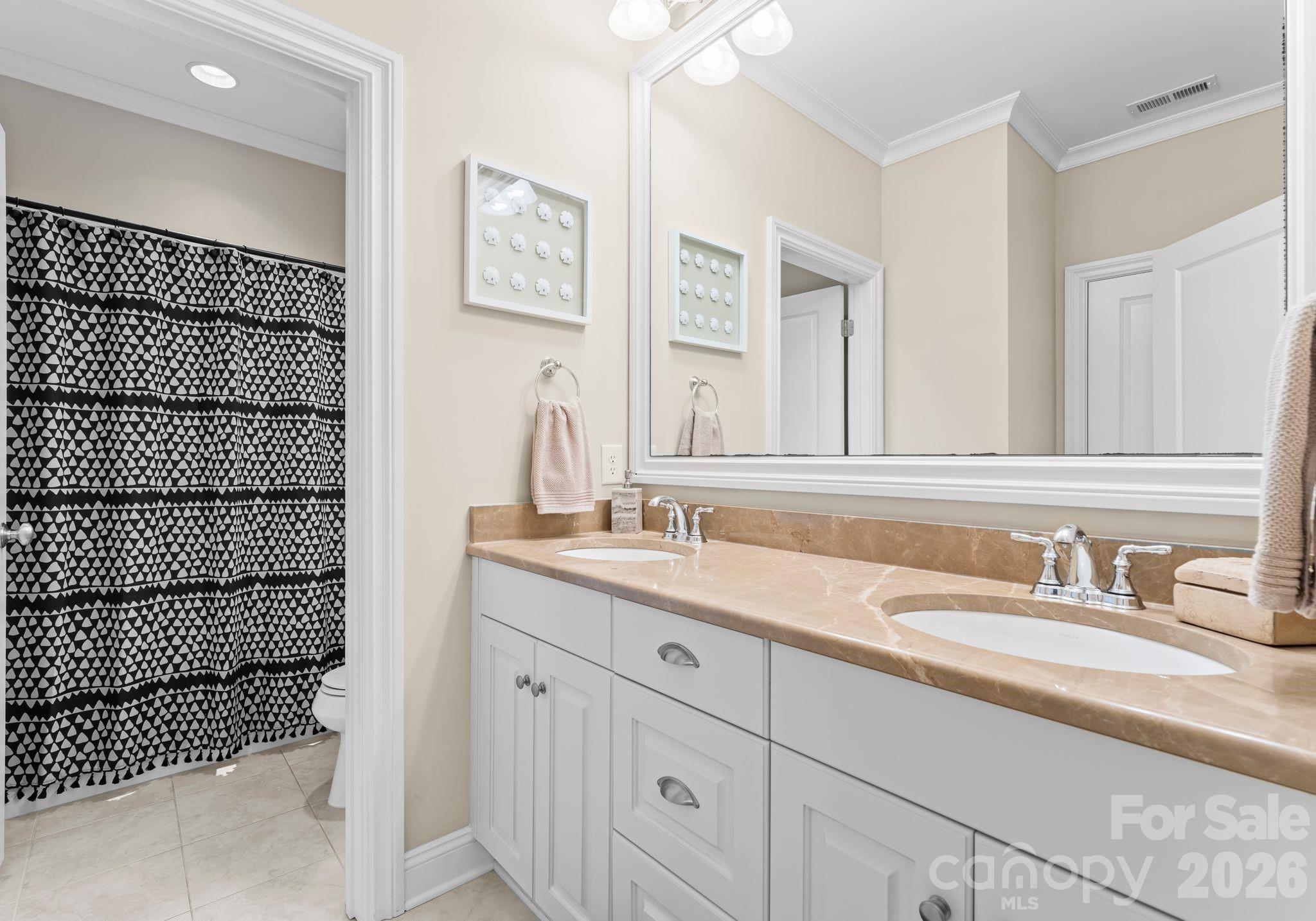 21311 Baltic Drive Cornelius, NC 28031 - Photo 26 of 39 a bathroom with a double vanity sink and a mirror