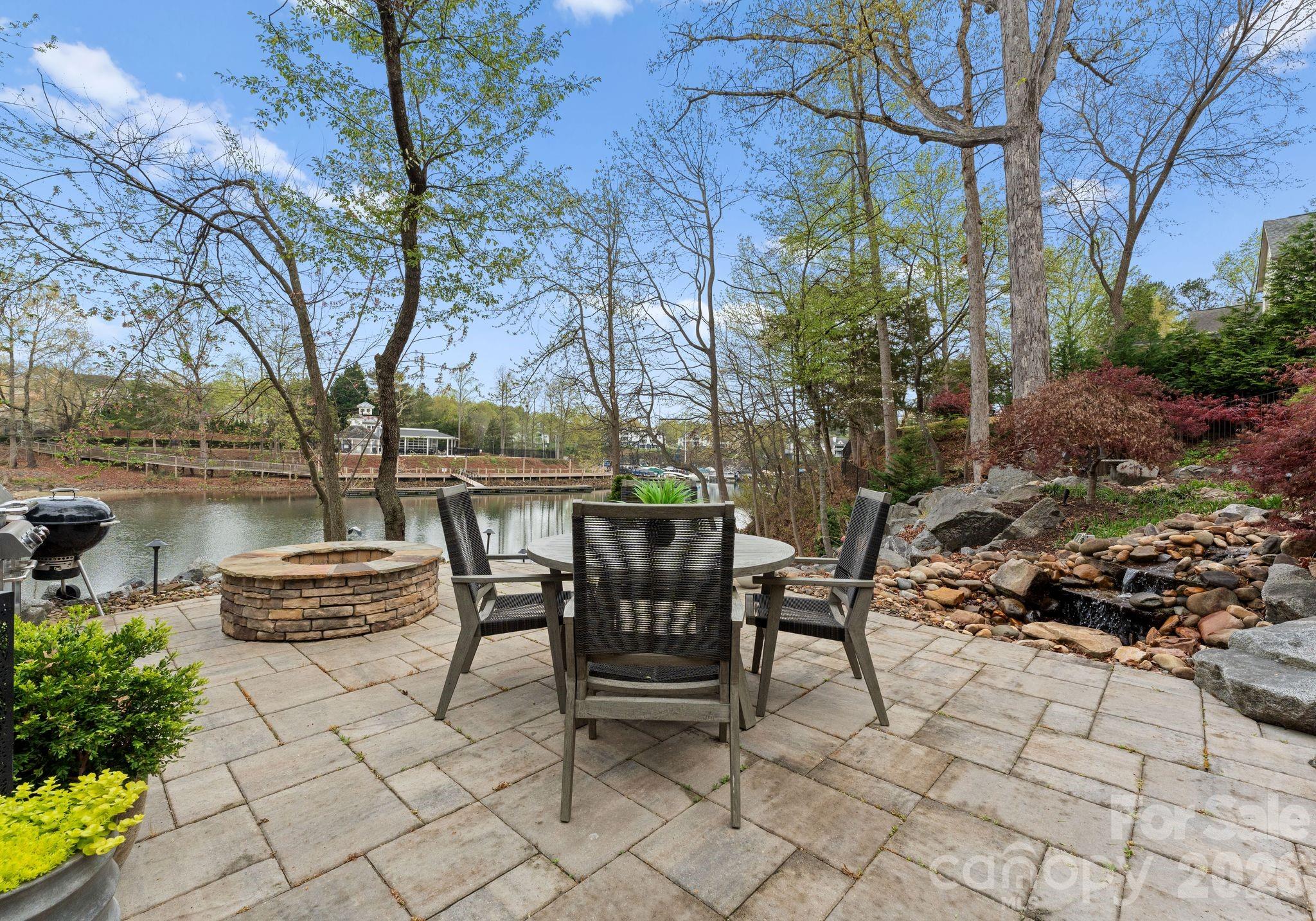 21311 Baltic Drive Cornelius, NC 28031 - Photo 36 of 39 a view of a patio with table and chairs and potted plants