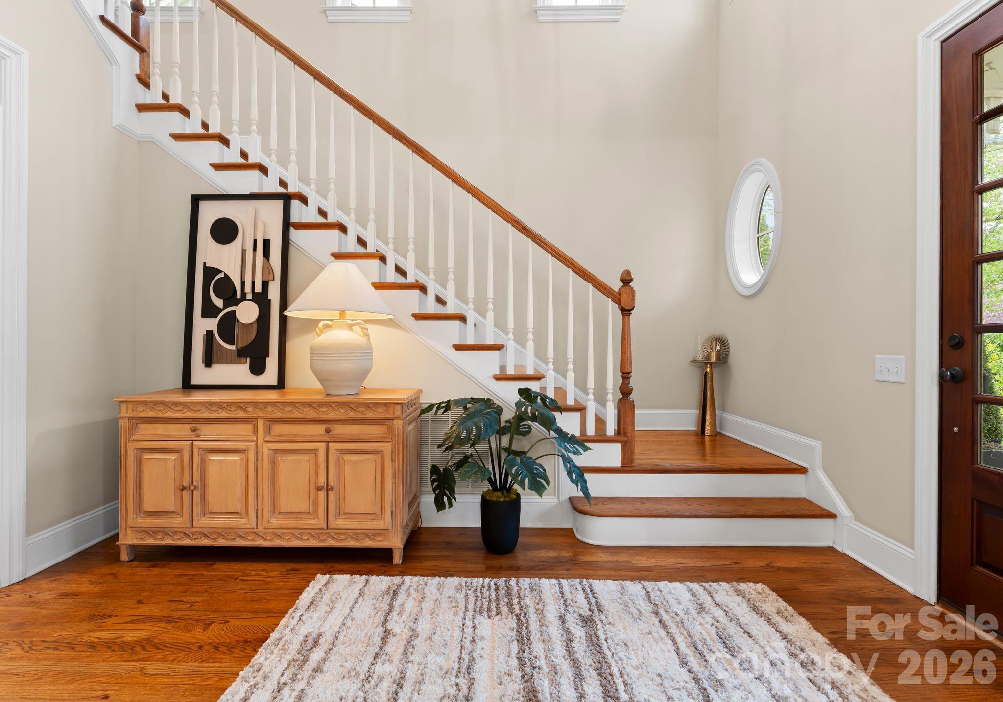 21311 Baltic Drive Cornelius, NC 28031 - Photo 4 of 39 a view of entryway and hall with wooden floor