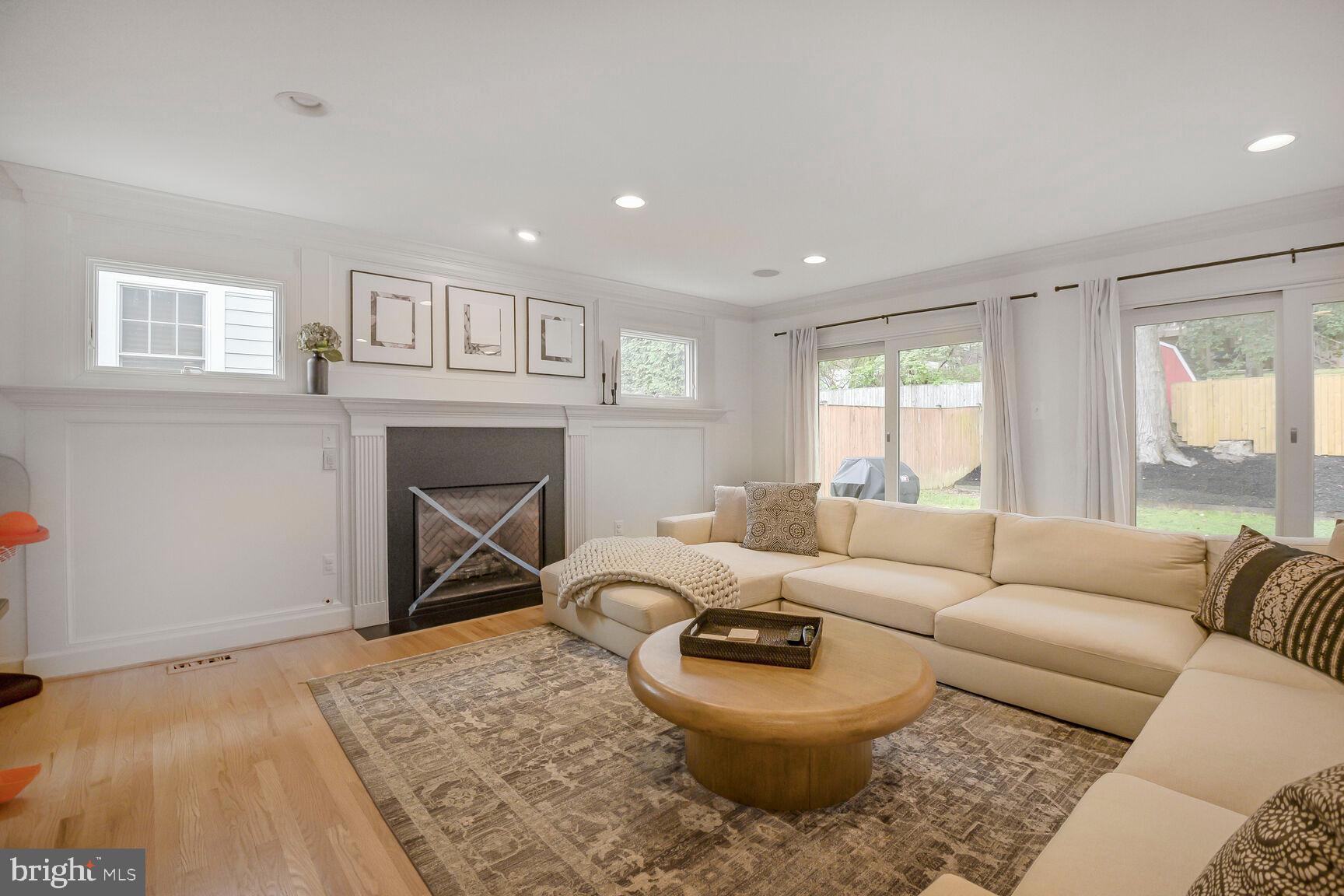 4403 Edgefield Road Kensington, MD 20895 - Photo 16 of 30 a living room with furniture a large window and a fireplace