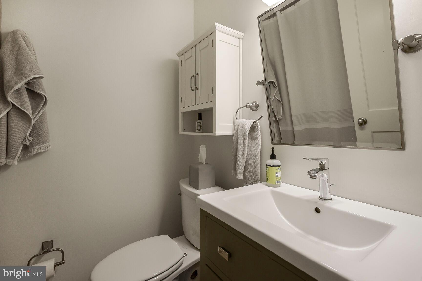 4403 Edgefield Road Kensington, MD 20895 - Photo 20 of 30 a bathroom with a sink toilet and shower