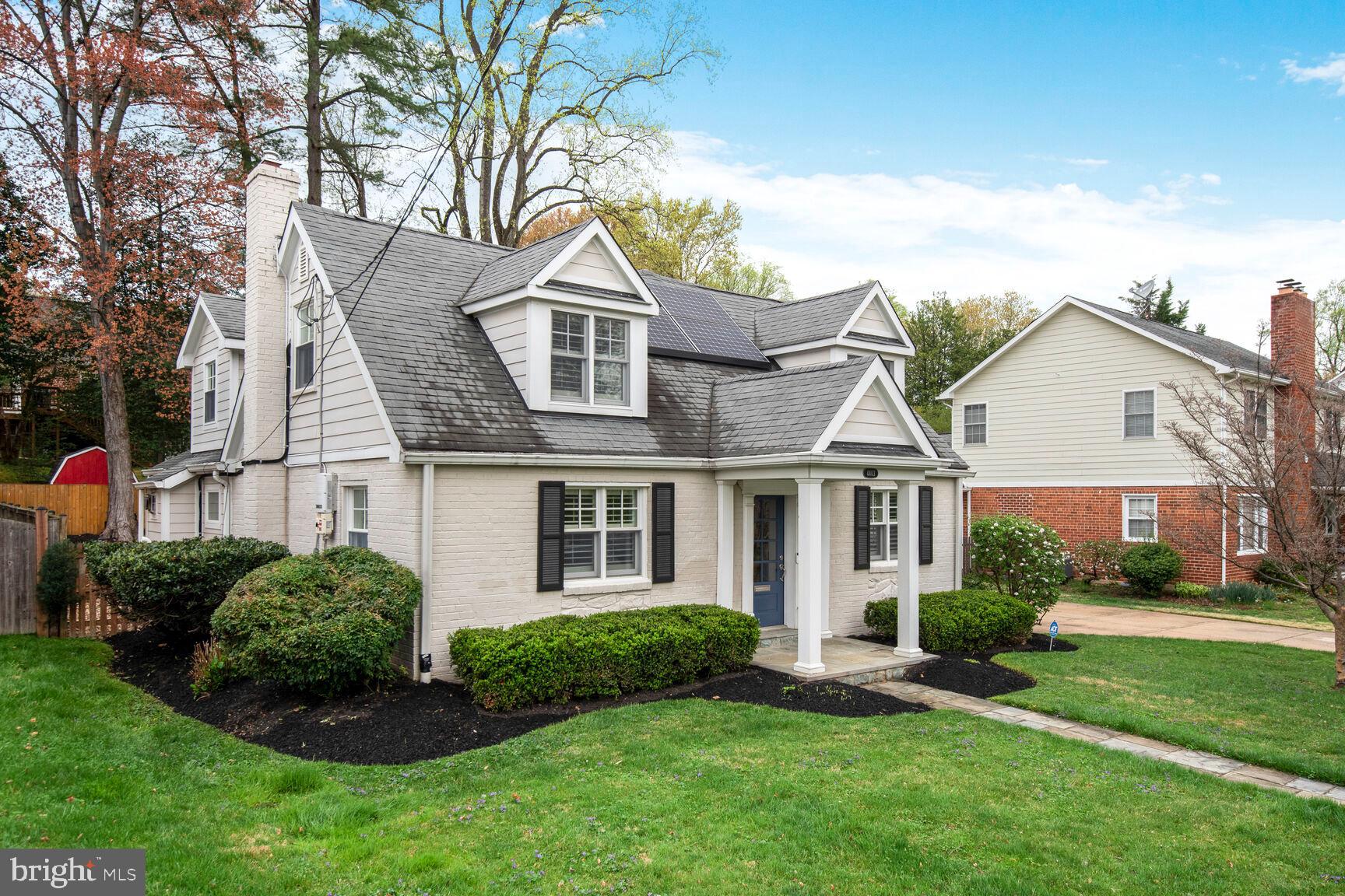 4403 Edgefield Road Kensington, MD 20895 - Photo 2 of 30 a front view of a house with a yard and garage
