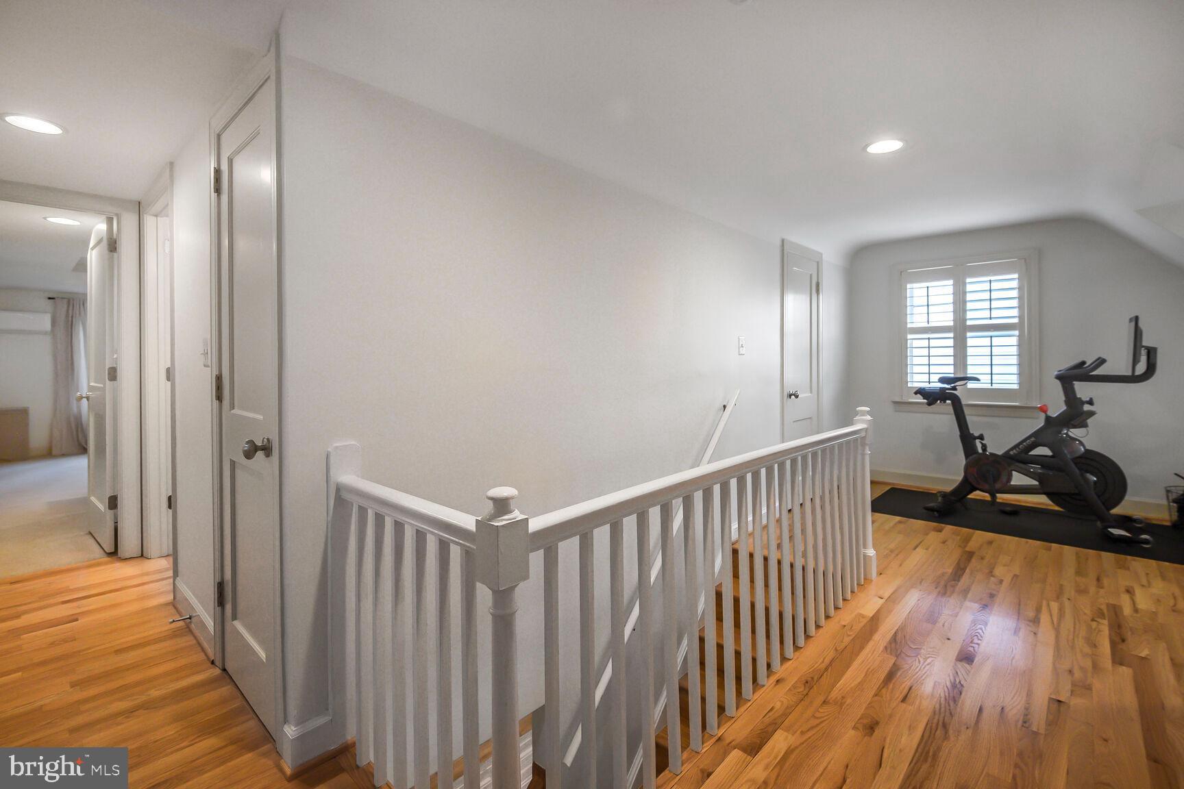 4403 Edgefield Road Kensington, MD 20895 - Photo 21 of 30 a view of a hallway with wooden floor and windows