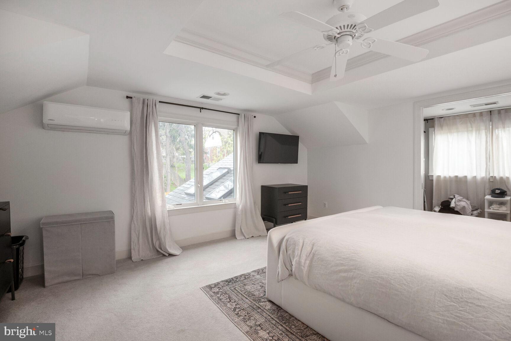 4403 Edgefield Road Kensington, MD 20895 - Photo 23 of 30 a bedroom with a bed and a television