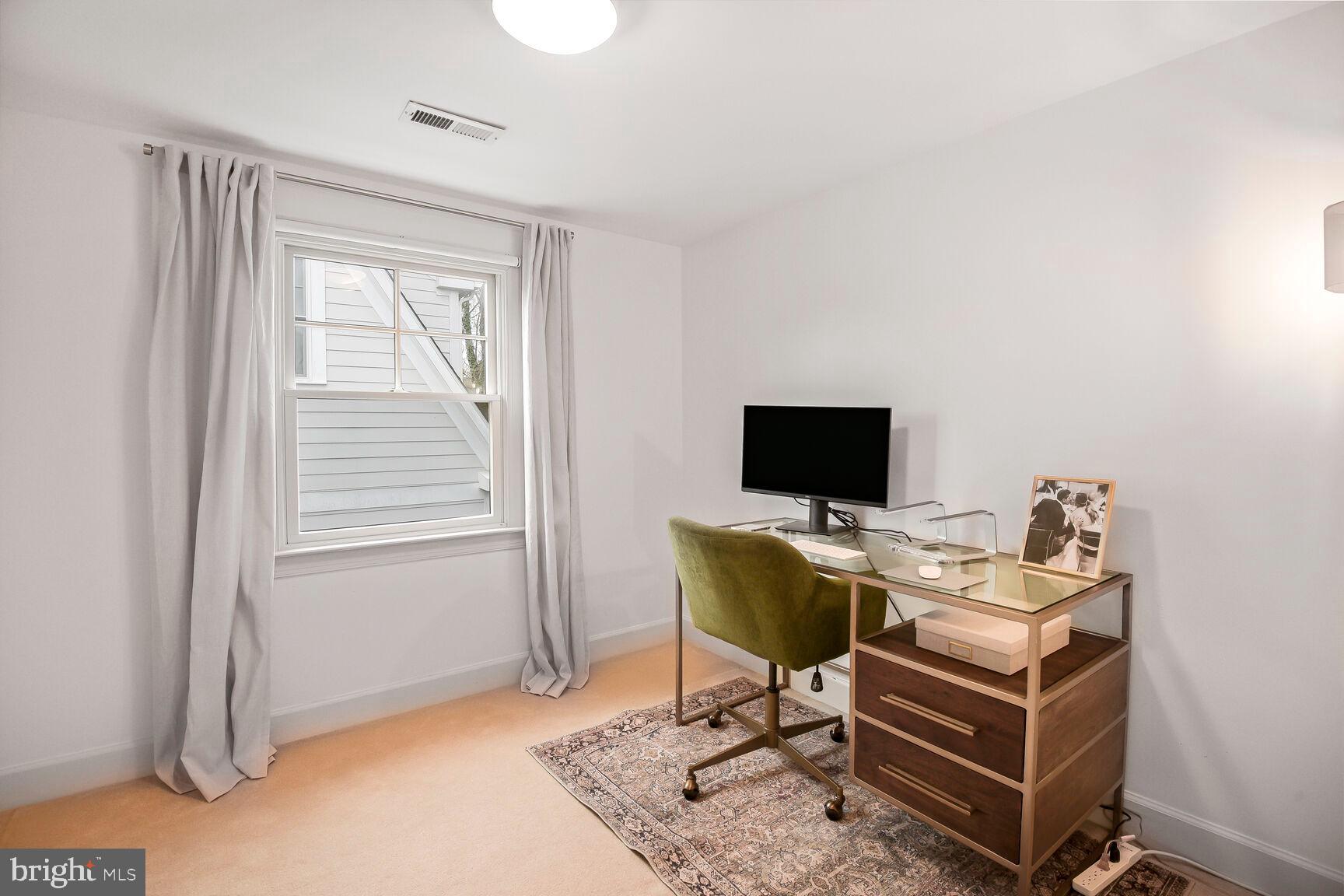 4403 Edgefield Road Kensington, MD 20895 - Photo 24 of 30 a living room with furniture and a flat screen tv