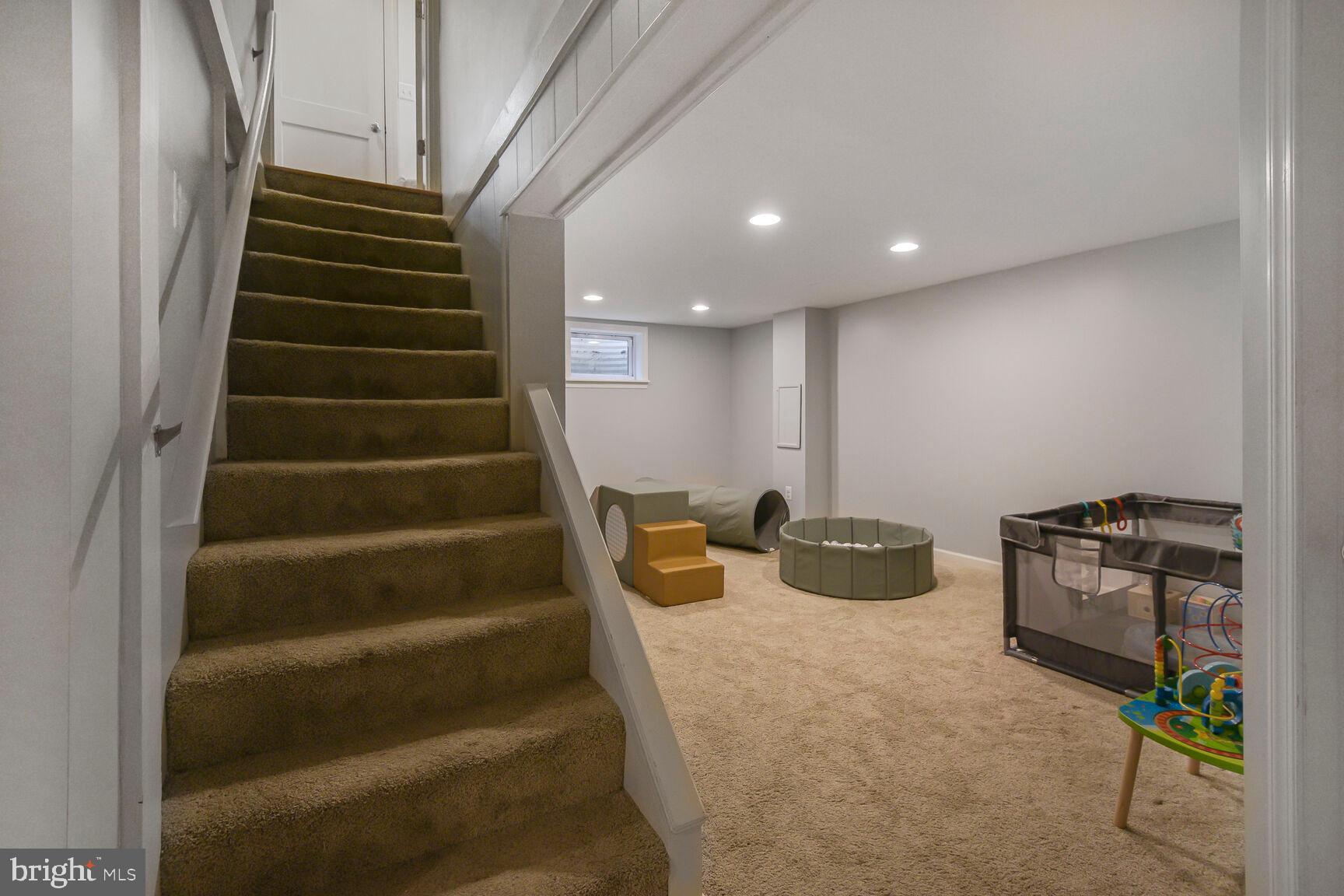 4403 Edgefield Road Kensington, MD 20895 - Photo 26 of 30 a room with stairs and a more windows