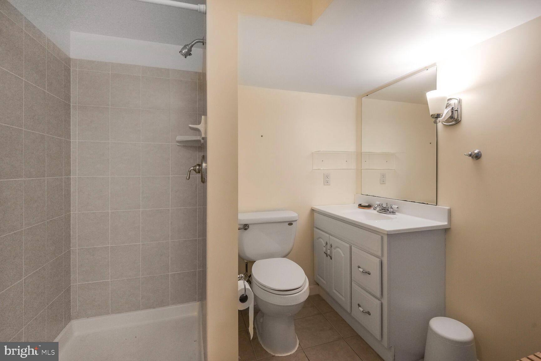 4403 Edgefield Road Kensington, MD 20895 - Photo 28 of 30 a bathroom with a sink a toilet and shower