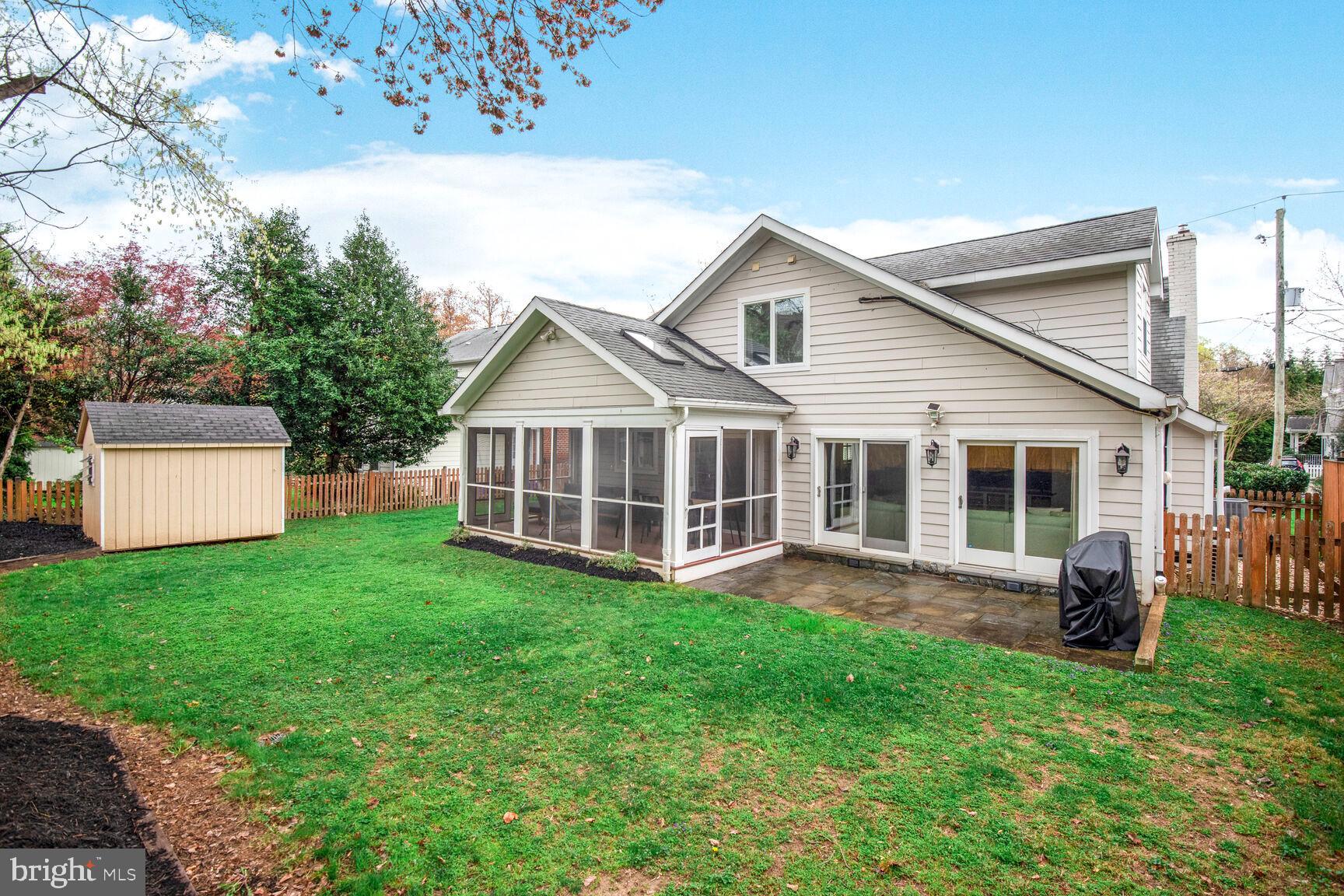 4403 Edgefield Road Kensington, MD 20895 - Photo 30 of 30 a view of a house with a big yard and sitting area