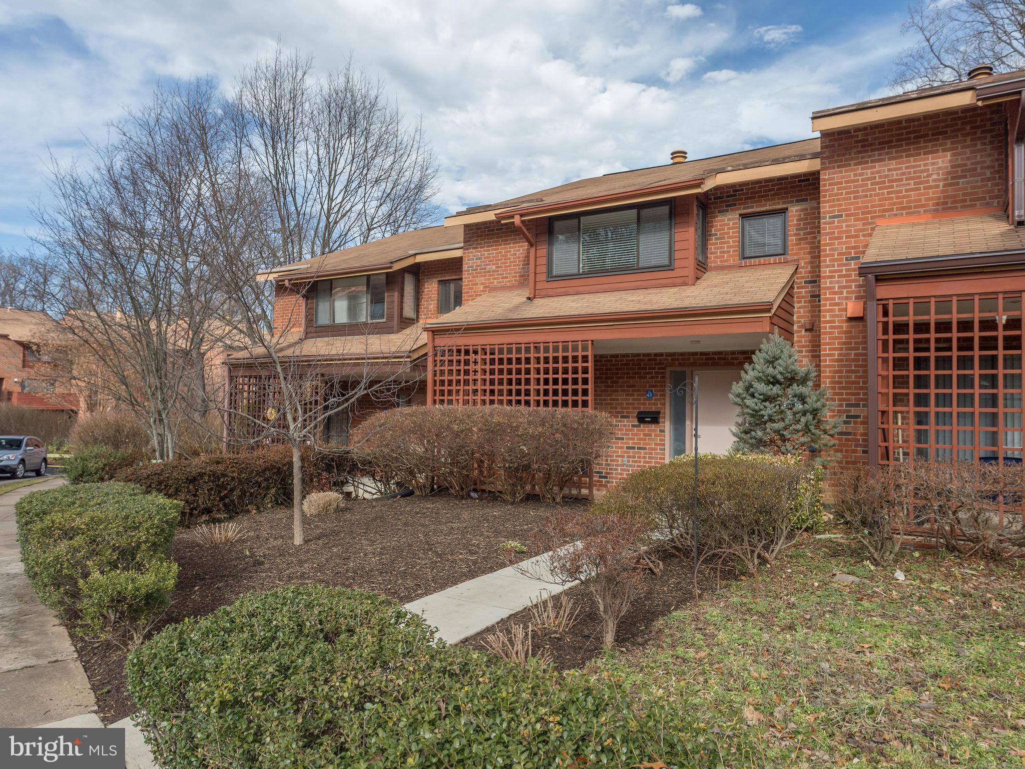 1663 Bachan Court Reston, VA 20190 - Photo 1 of 29 a front view of a house with a garden