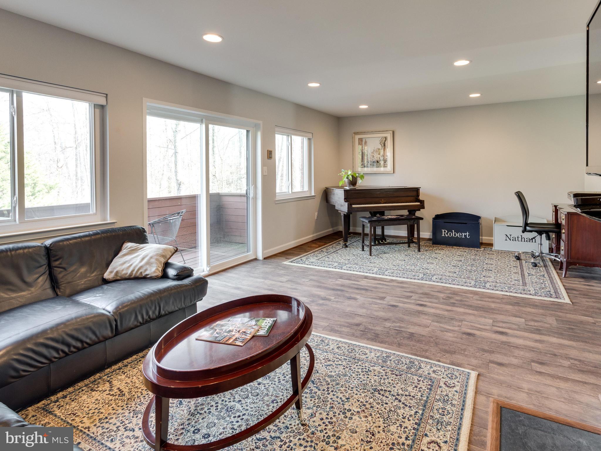 1663 Bachan Court Reston, VA 20190 - Photo 11 of 29 a living room with furniture and a rug